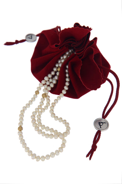 Serious Polka Dot Pearl Necklace - a three-row white fresh-water pearls necklace by Peregrina Pearls in branded packaging