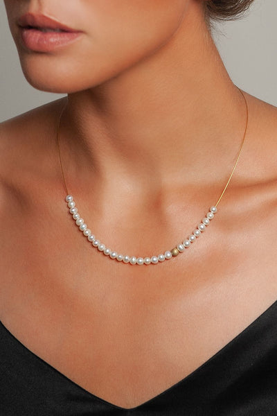 Abacus Pearl Necklace with Gold Bead by Peregrina Pearls on a Model