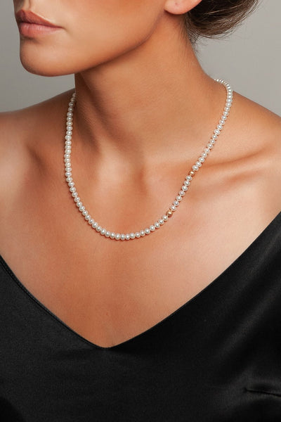 Polka Dot Pearl Necklace by Peregrina Pearls on a Model