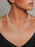 Serious Polka Dot Pearl Necklace by Peregrina Pearls on a Model