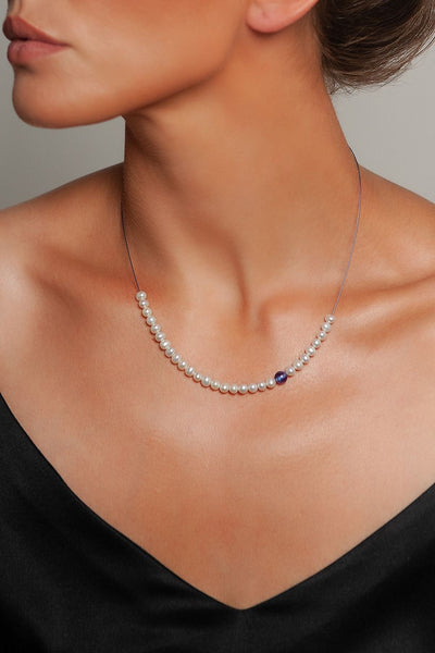 Abacus Pearl Necklace with a Tanzanite Bead by Peregrina Pearls on a Model