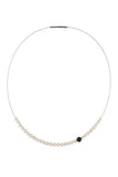 Abacus Pearl Necklace with an Onyx Bead by Peregrina Pearls - 28 small white freshwater pearls running on a steel cord, dramatized by one matte Onyx bead. A very nice black-and-white.