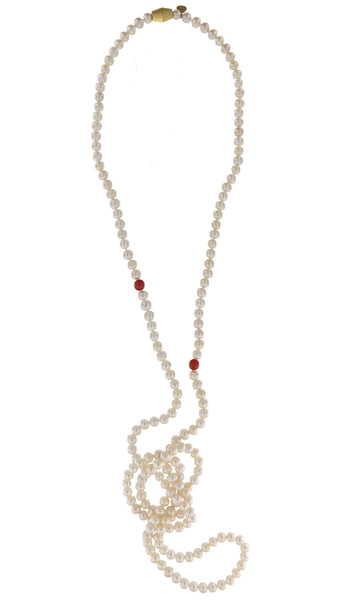 Dearest Coco Pearl Necklace by Peregrina Pearls - a rope-style necklace featuring white freshwater pearls, accentuated by two genuine coral beads