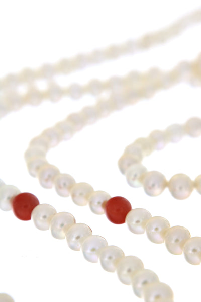 Dearest Coco Pearl Necklace by Peregrina Pearls - a close-up to the coral beads. The camera, unfortunately, does not communicate the true soft shade of the beads.
