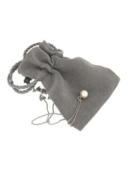 White Pearl Bubble Pendant on its soft pouch