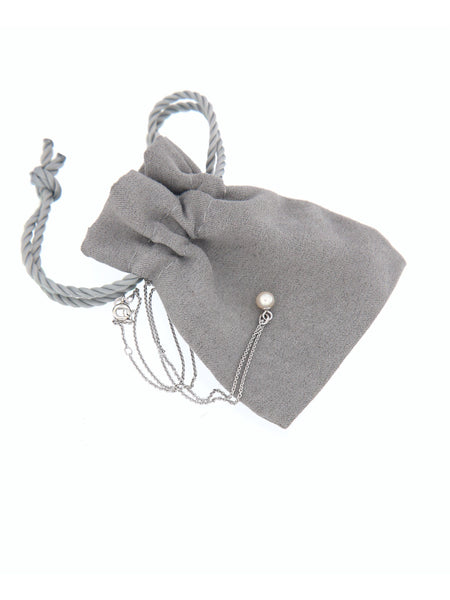Tiny White Pearl Bubble Pendant on its soft pouch