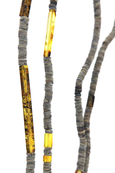 Sunny Days in Klaipeda Necklace by Nadia Sitalo - a close-up uncovering uniqueness of each shell bead and amber tube.